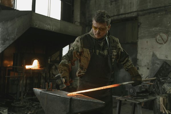 Where can tourists find the most detailed workshops on traditional British blacksmithing techniques?